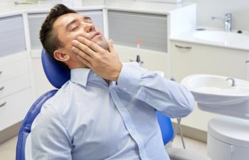 patient holding his jaw